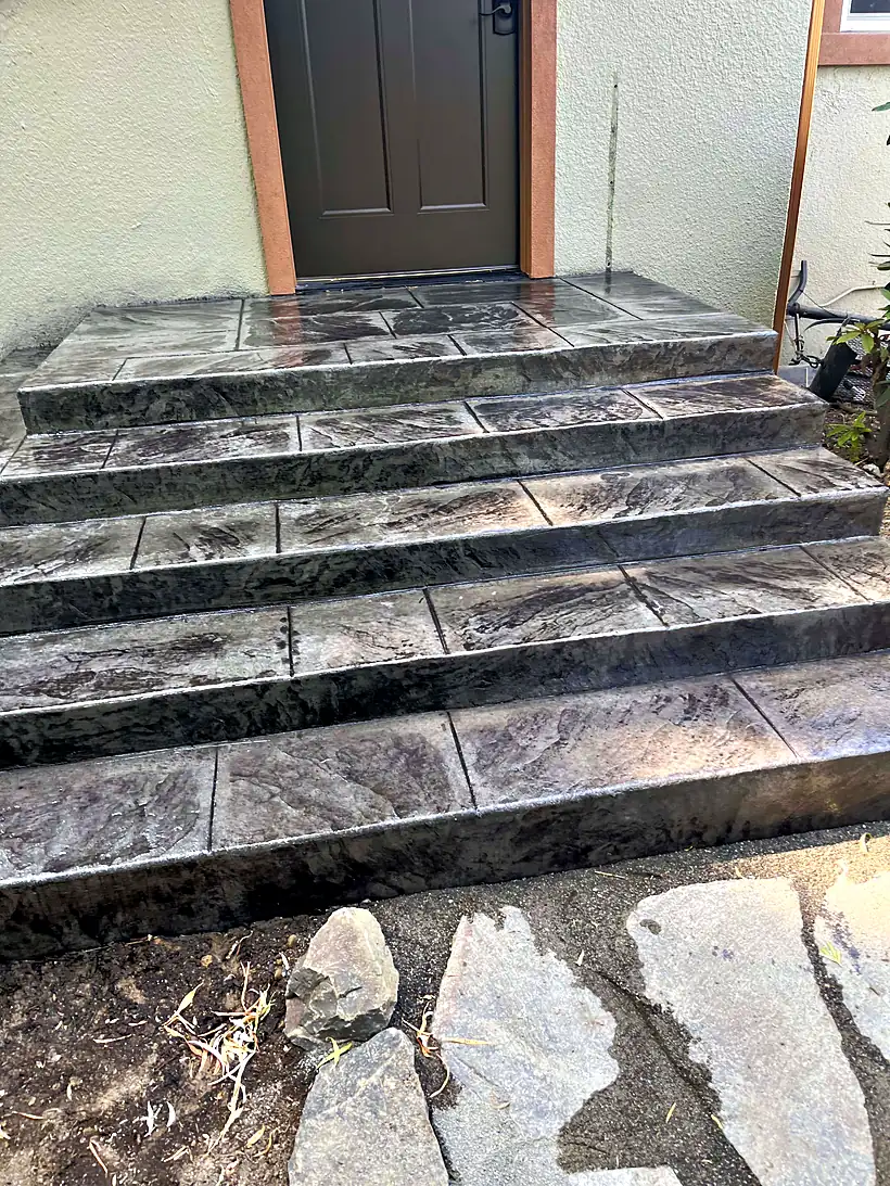 Stamped concrete front steps by Reyes Brothers Construction