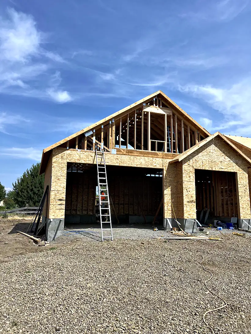 New house framed by Reyes Brothers Construction, roof trusses in place